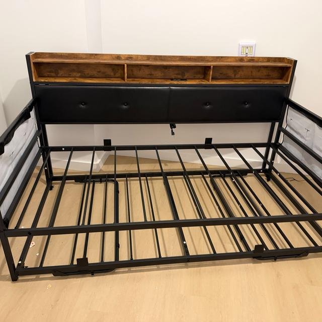 Black metal daybed with trundle, assembled