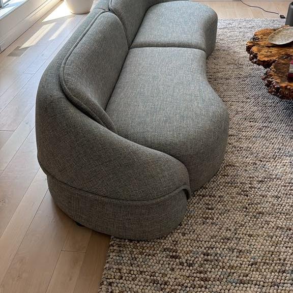 Curved grey sofa, assembled