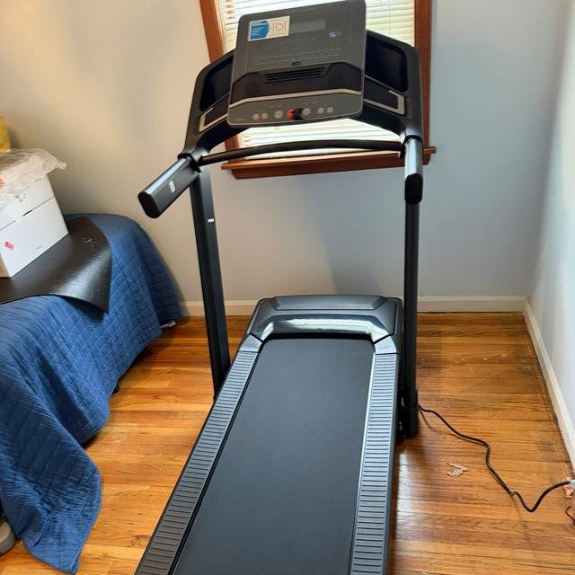 Folding treadmill, assembled in a bedroom