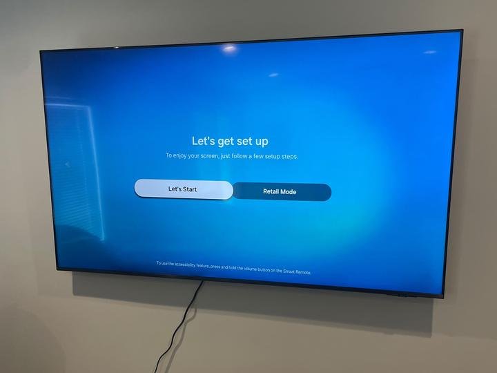 A flat-screen TV mounted on a wall by Pamphile Assembly