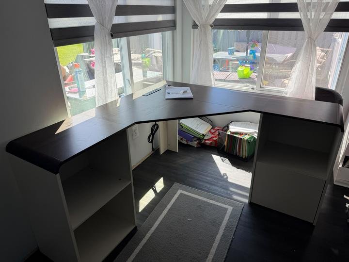 An L-shaped corner desk assembled in a home office